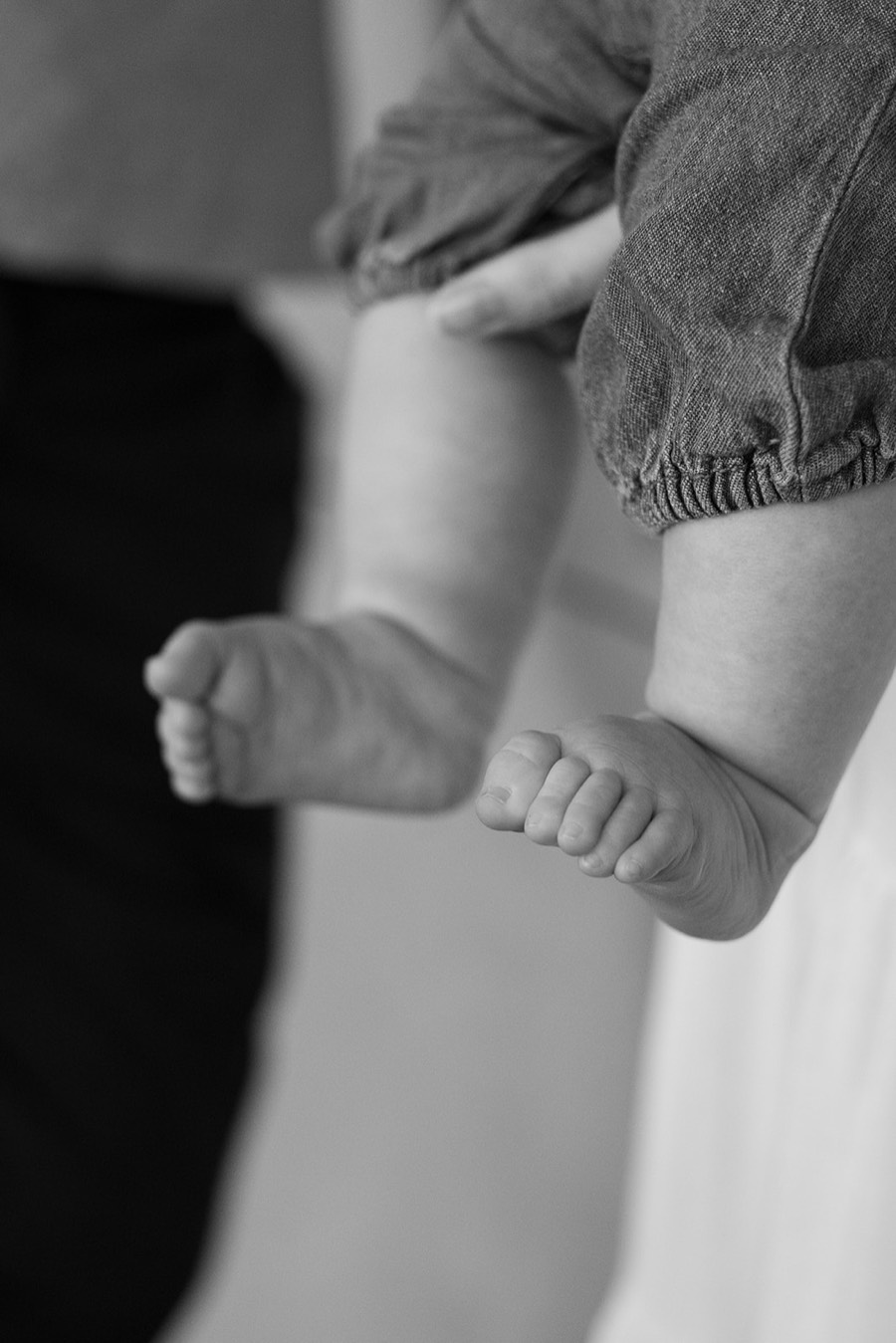 Tiny baby feet mid-change at the pilot