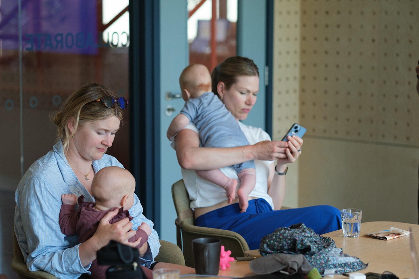 A mum listening intently with her baby at the pilot