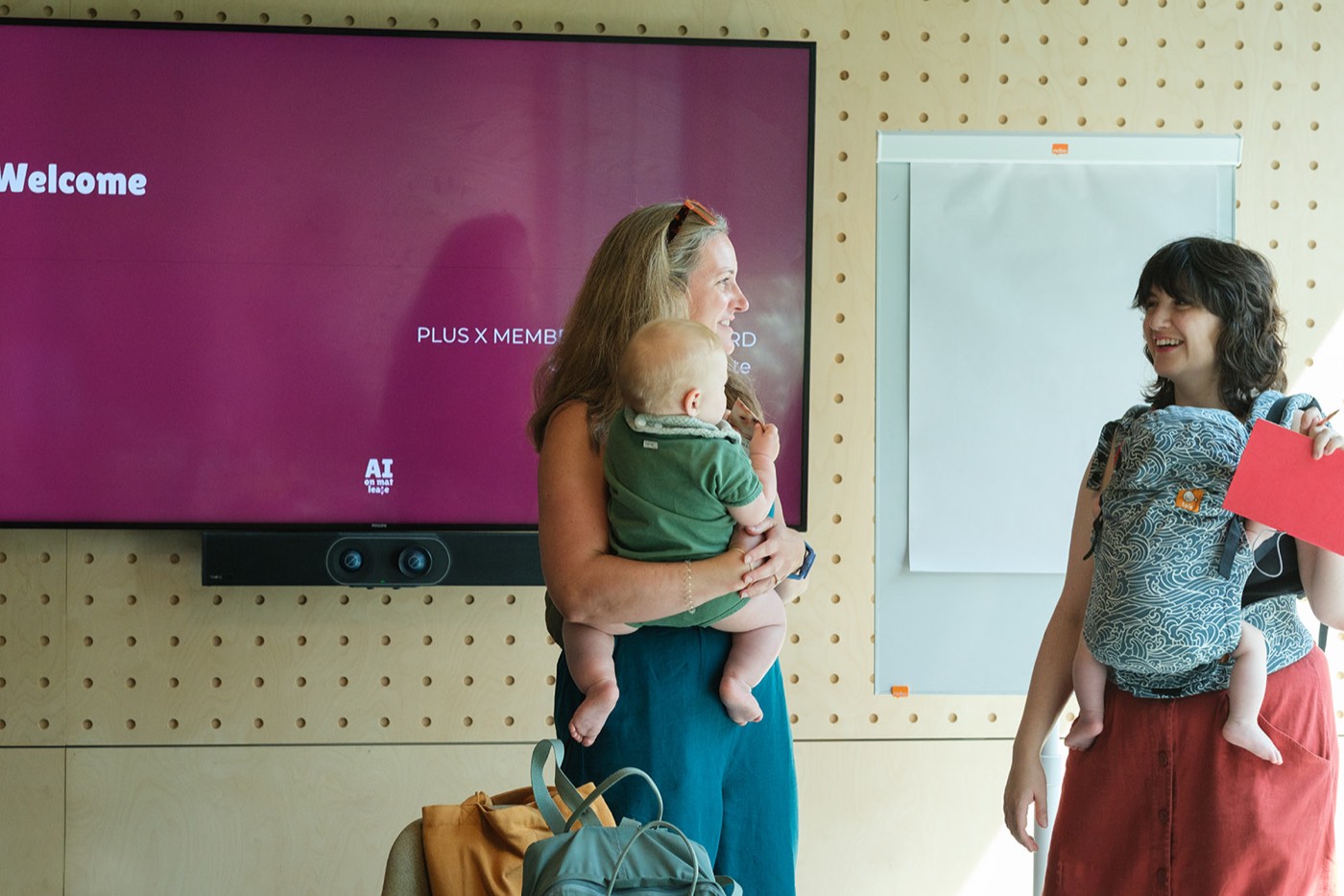 Mums and babies gathering at the pilot in front of the welcome screen